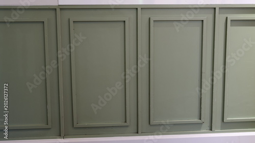 Green paneled wall interior design detail
