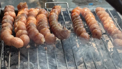 Thai Street Food Sausage Balls Cooking over Hot Coals