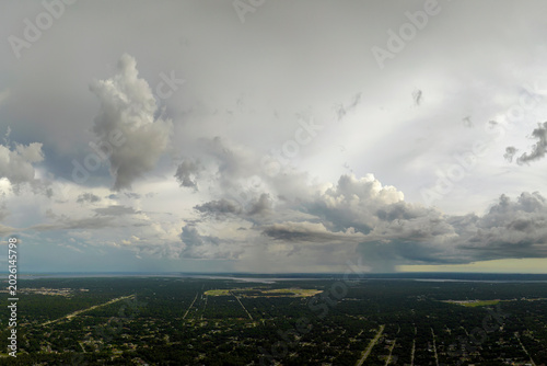 Tropical thunderstorm precipitation falling down on Florida town. Rain shower in summer