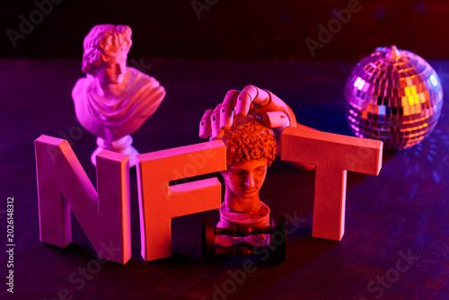 Obraz na płótnie Classical sculpture with robotic hand and disco ball in neon lighting for NFT co