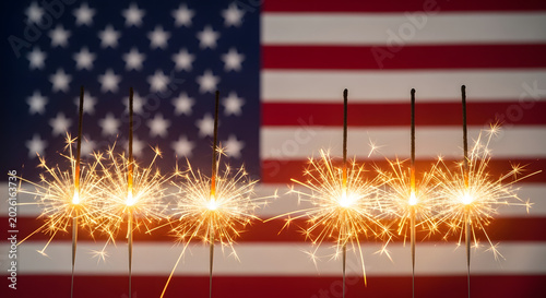 Sparklers on 4th of july with american flag background