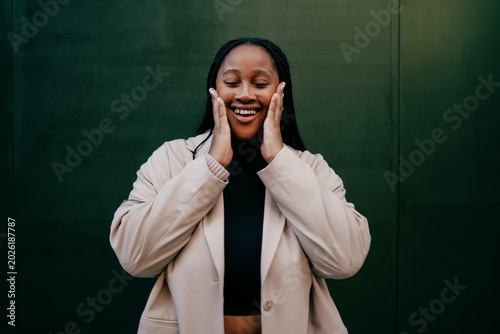 Bild auf Leinwand Overjoyed woman laughing with closed eyes authentic representation sincerly joy