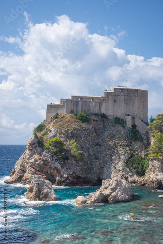 The historic Fort Lovrijenac on a rocky cliff and the blue Adriatic Sea in Dubrovnik, Croatia, on a sunny day