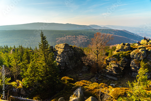 Scenic view from Frydlantske cimburi rock formation in autumn Jizera Mountains during golden hour