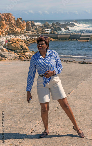 Kleinmond Western Cape South Africa. 05.11.2026.  Attractive female holidamaker exercising on the seafront at Kleinmond in the Western cape South Africa.