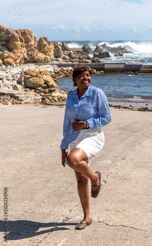 Kleinmond Western Cape South Africa. 05.11.2026.  Attractive female holidamaker exercising on the seafront at Kleinmond in the Western cape South Africa.