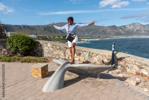 Hermanus Western Cape South Africa. 14.05.2026. Holidaymaker taking in the beautiful view from a seaside sculpture on the promenade at Hermanus Western Cape South Africa.