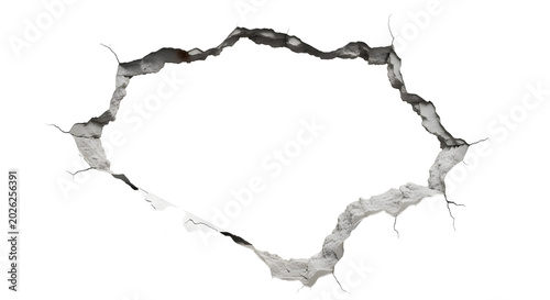 Concrete wall break through with cracked edges isolated on white background