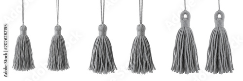 Fotografía Set and collection of two grey decorative curtain tassels isolated on white tran