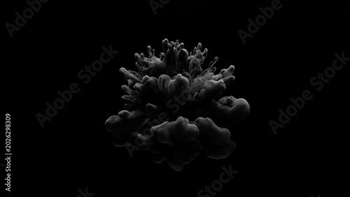 Abstract black and white ink explosion in water dark background slow motion