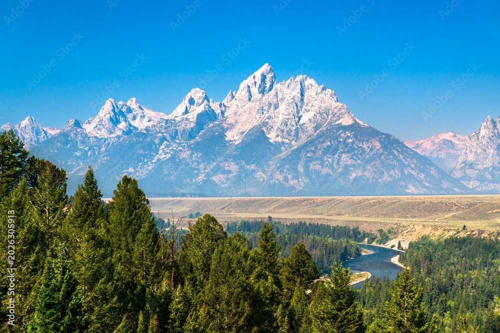 Obraz premium View of the Teton Mountain Range above the Snake River in Grand Teton National Park - Wyoming, United States