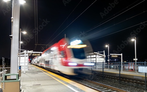 Konstfotografi Motion-blurred San Jose - San Francisco commuter train arriving at San Bruno sta