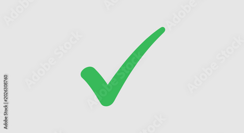 Fotografie Green check mark symbol on a light gray background for confirmation and approval