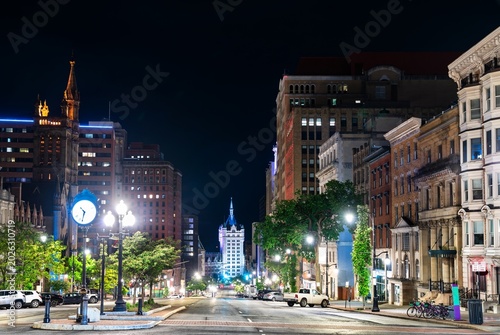 Night view down State Street in downtown Albany, New York, flanked by historic architecture and streetlights, United States