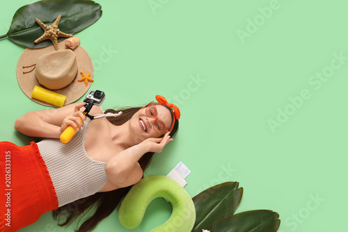 Young woman with travel acc...