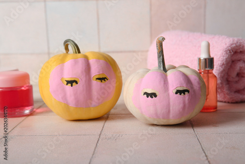 Pumpkins with clay masks, c...