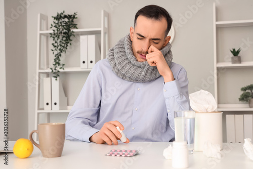 Ill businessman with scarf ...