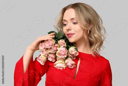 Pretty young woman with bou...