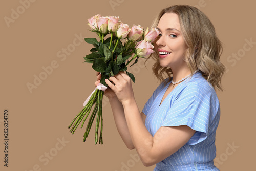 Happy young woman with bouq...