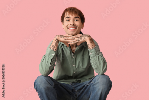 Happy handsome young tattoo...
