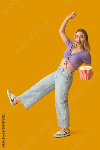 Young woman with bucket of ...