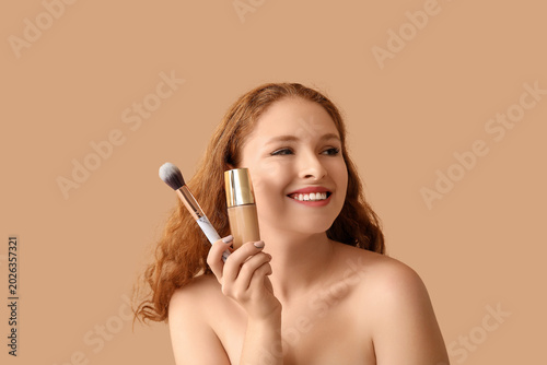 Young redhead woman with ma...