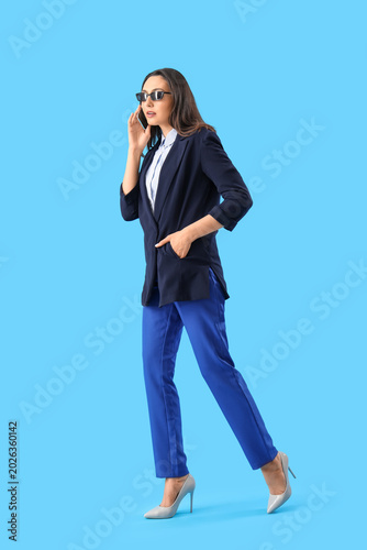 Young woman in stylish suit...