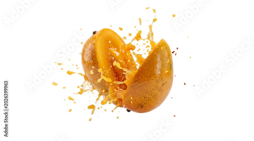 Ripe Mango Exploding with Juice Splash Isolated on White Background