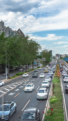 Blue skies and white clouds over Beijing's East Third Ring Road, and the flow of cars.