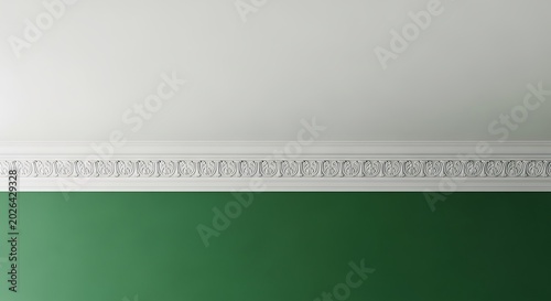 White ornate crown molding atop a vibrant green wall