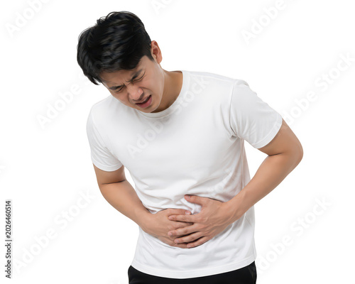 Abdominal Pain: A young Asian man clutches his stomach, his face contorted in a grimace of pain, indicating discomfort or illness.