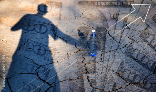 Canvas Print A conceptual story about the lack of drinking water, featuring clay cracked by the heat, a shadow of a person, a bottle of water, and $100 bills