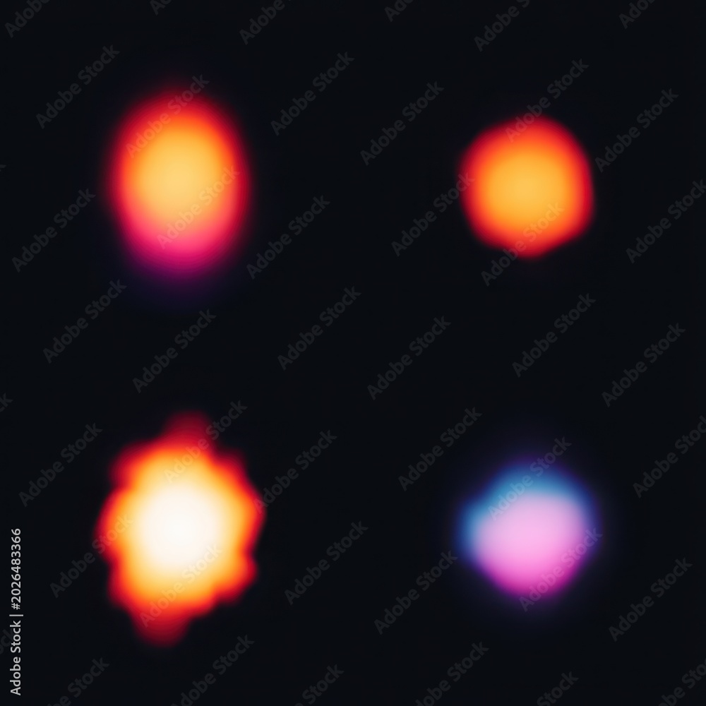 Fototapeta premium Abstract colorful lights in a blurred dark background.