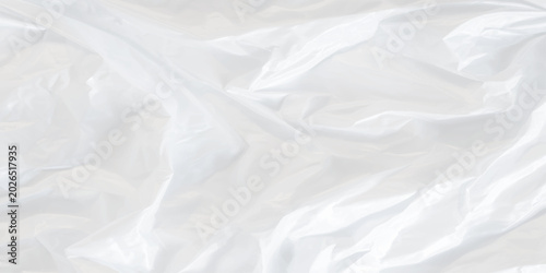 Foto Crumpled white plastic sheet texture background with creases and folds