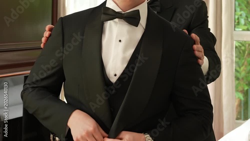 Groom In Black Tuxedo Getting Ready Before Wedding Ceremony