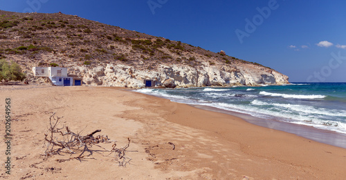 Beautiful Agios Ioannis beach with traditional boat houses in Milos, Greece