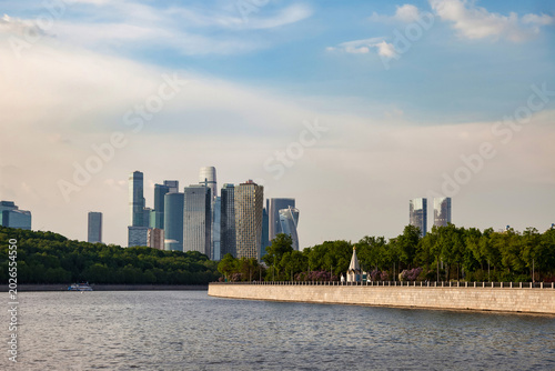 Photography Moscow City skyline shows modern buildings along the river