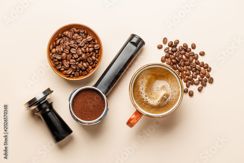 Фотография Espresso coffee setup with beans tamper and portafilter top view