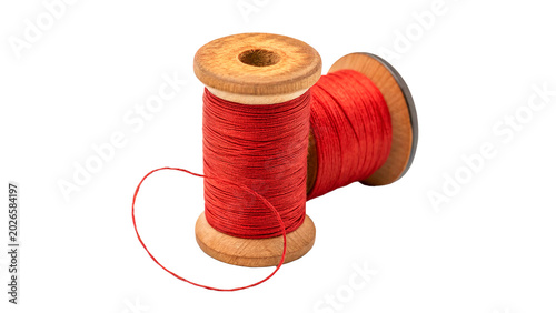 Photos A vintage wooden sewing spool roll filled with bright red textile thread isolate