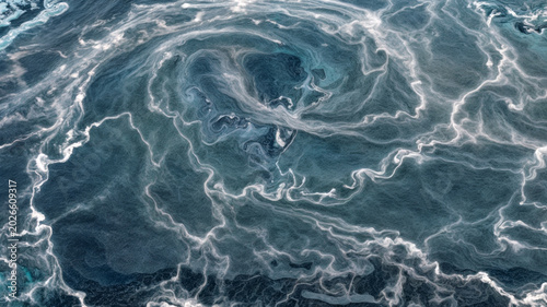 Fotografie Drone view of a swirling intricate pattern of white and gray sea surface radiati