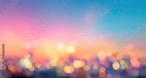 Soft focus bokeh lights against a dreamy pastel sky at dusk