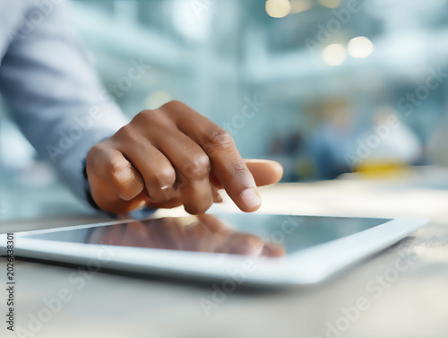 Person using a tablet computer with a shallow depth of field