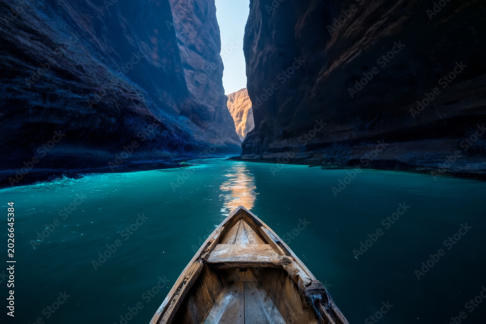 Fototapeta premium Small weathered wooden boat navigating a wide river, entering a canyon with towering rock walls and soft cyan water glow illuminating the scene ahead