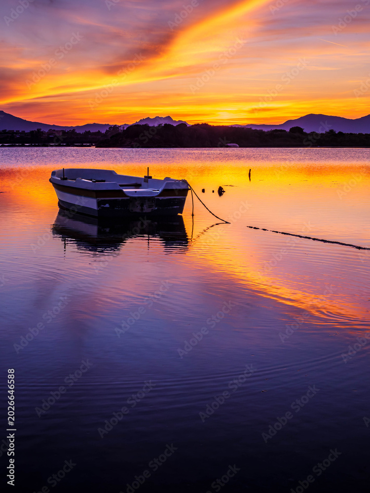 Fototapeta premium Fishermen''s boats in a bay in the sunset