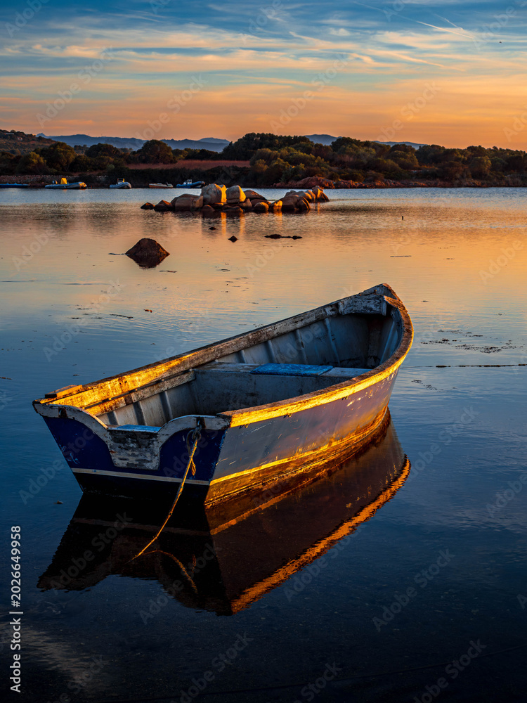 Fototapeta premium Fishermen''s boats in a bay in the sunset