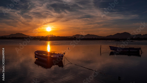 Konstfotografi Fishermen''s boats in a bay in the sunset
