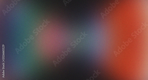 Abstract grainy gradient background with dark hues and vibrant glow.