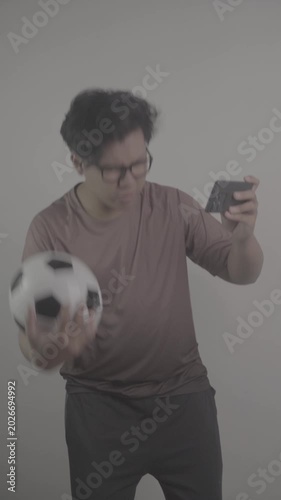 Southeast Asians watch football on their phones, then get frustrated and annoyed when the opposing team scores goal S-Log3, S-Gamut3.Cine