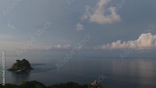 The background for evening scene in summer vacation concept with the nature of tranquil ocean horizon under a bright blue sky and white clouds	