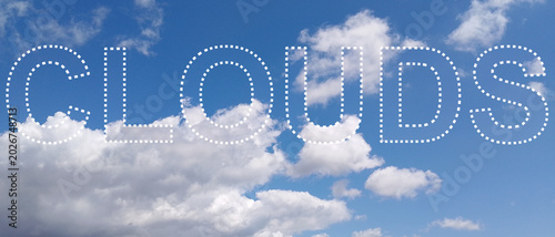 blue sky with clouds, text
